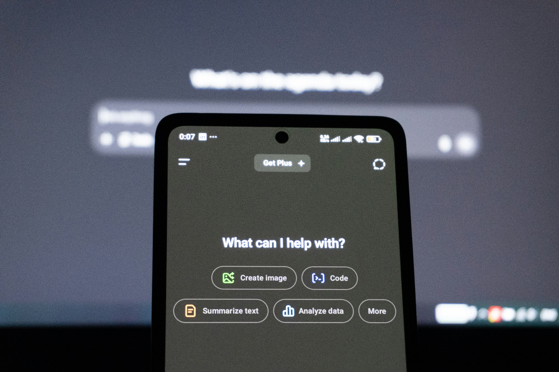 A smartphone displaying an AI assistant interface with options like Create image, Code, Summarize text, and Analyze data
